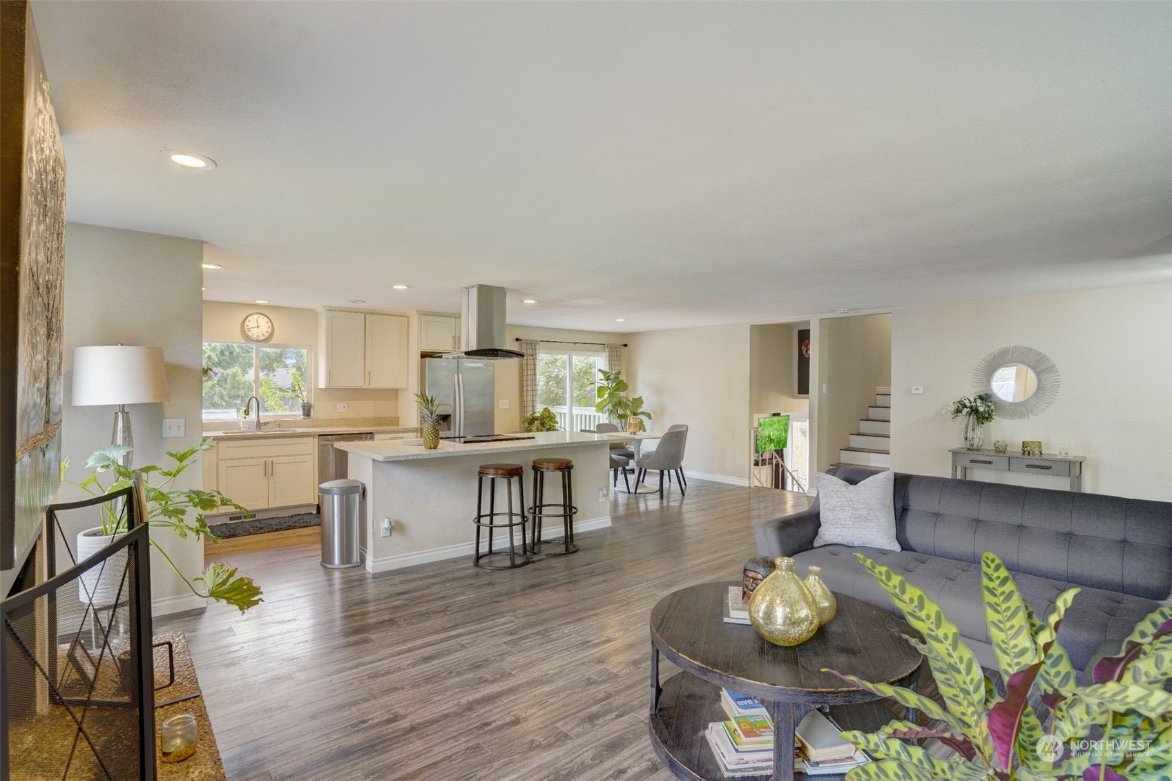 968 Brookdale Road East Tacoma, WA 98445 - Photo 8 of 31 a open dining room with kitchen island furniture wooden floor and appliances