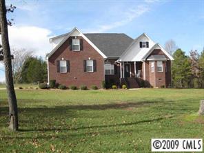 4430 Plyler Mill Road Monroe, NC 28112 - Photo 1 of 8 a front view of a house with a yard