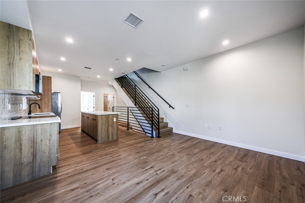 2129 Aaron Street, Unit 2 Los Angeles, CA 90026 - Photo 3 of 15 a view of a kitchen with wooden floor and electronic appliances