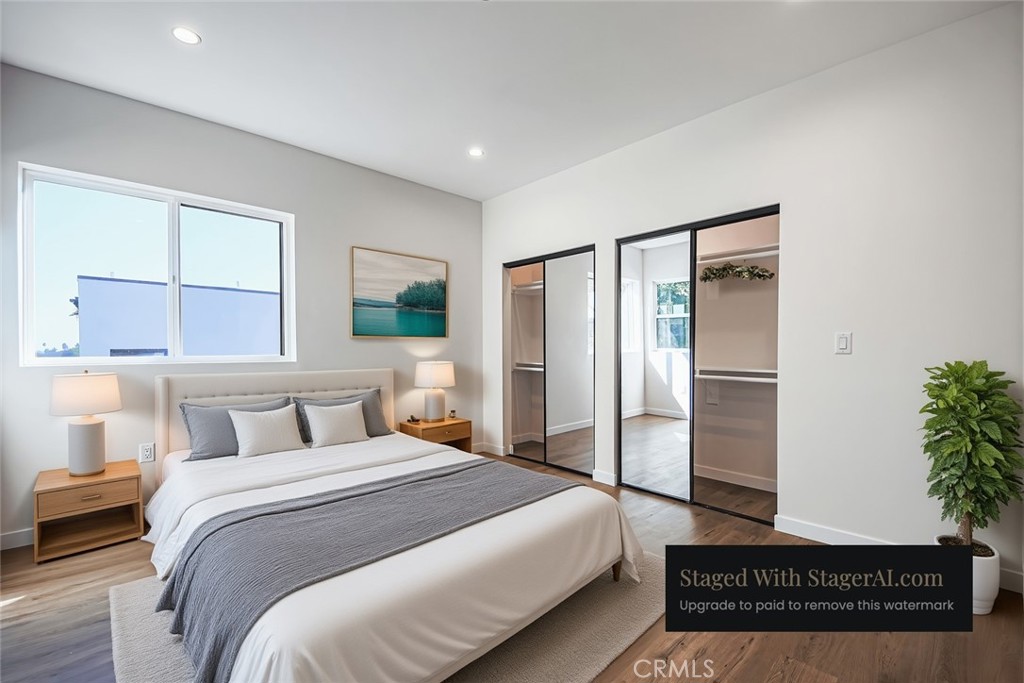 2129 Aaron Street, Unit 2 Los Angeles, CA 90026 - Photo 4 of 15 a bedroom with a large bed and potted plant