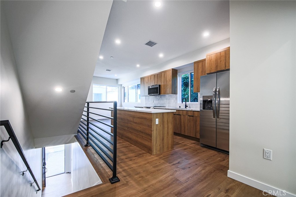 2129 Aaron Street, Unit 2 Los Angeles, CA 90026 - Photo 7 of 15 a kitchen with a refrigerator and a sink