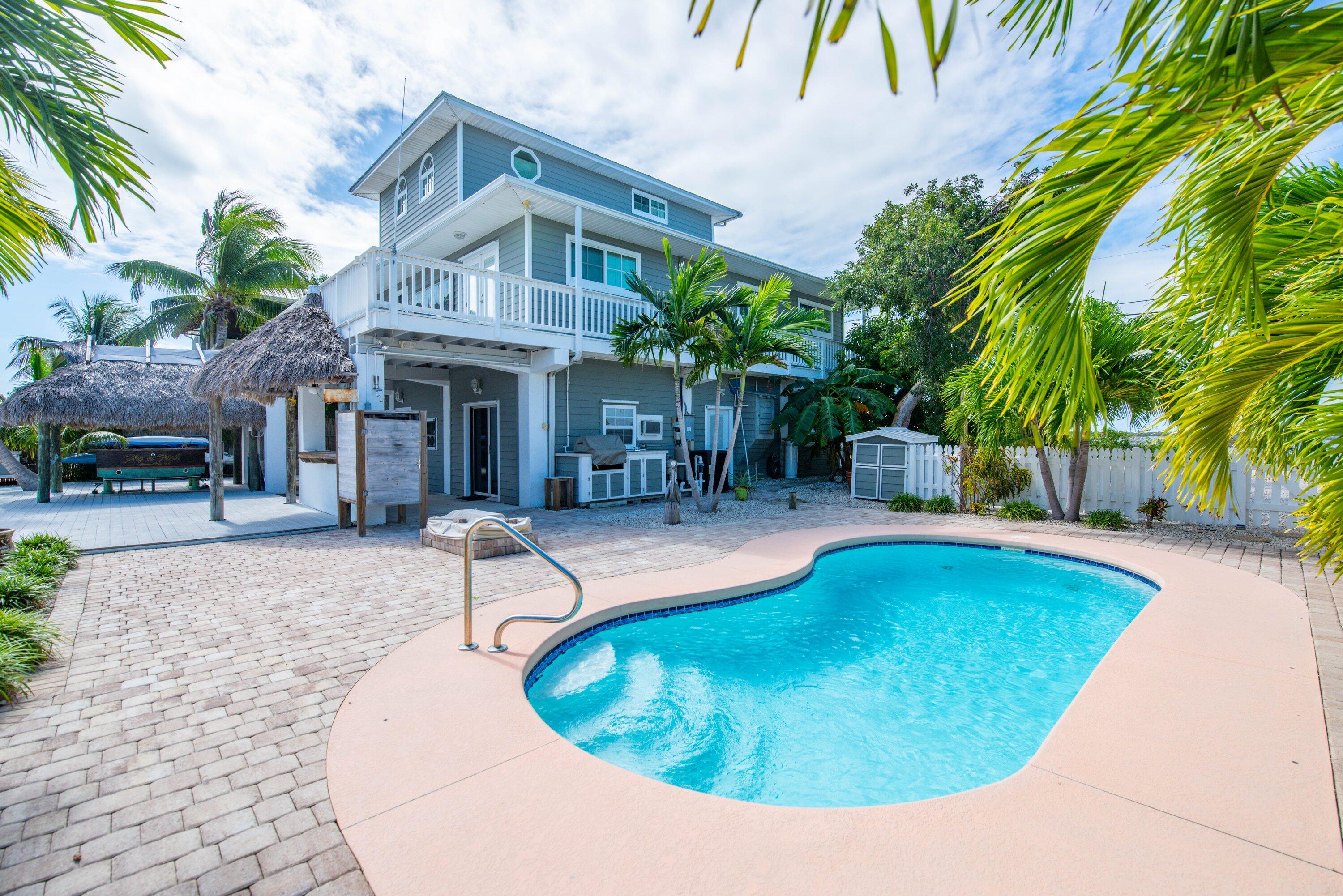 643 Indies Road Summerland Key, FL 33042 - Photo 14 of 50 a view of a house with swimming pool and sitting area