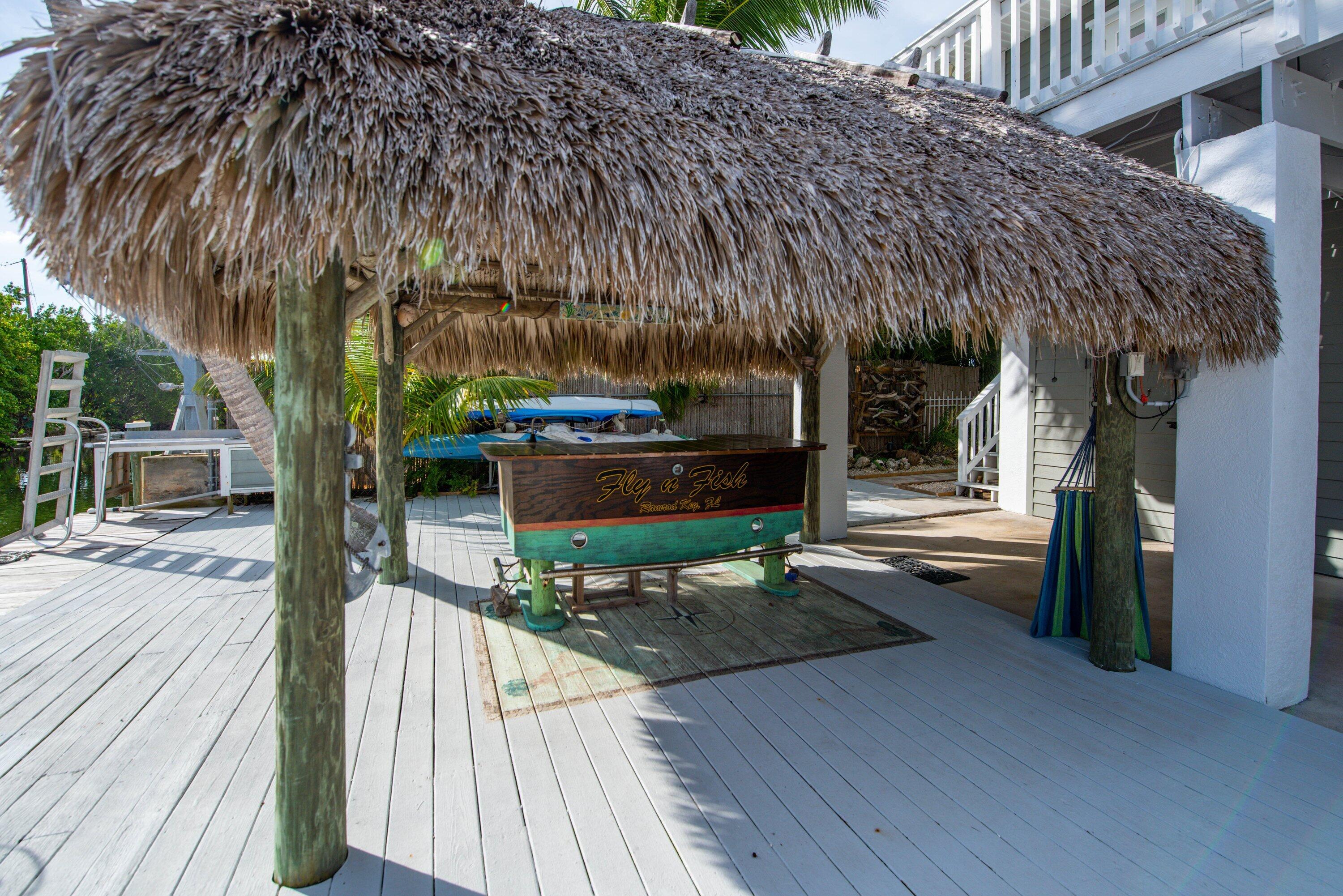 643 Indies Road Summerland Key, FL 33042 - Photo 23 of 50 a patio with glass top table and chairs
