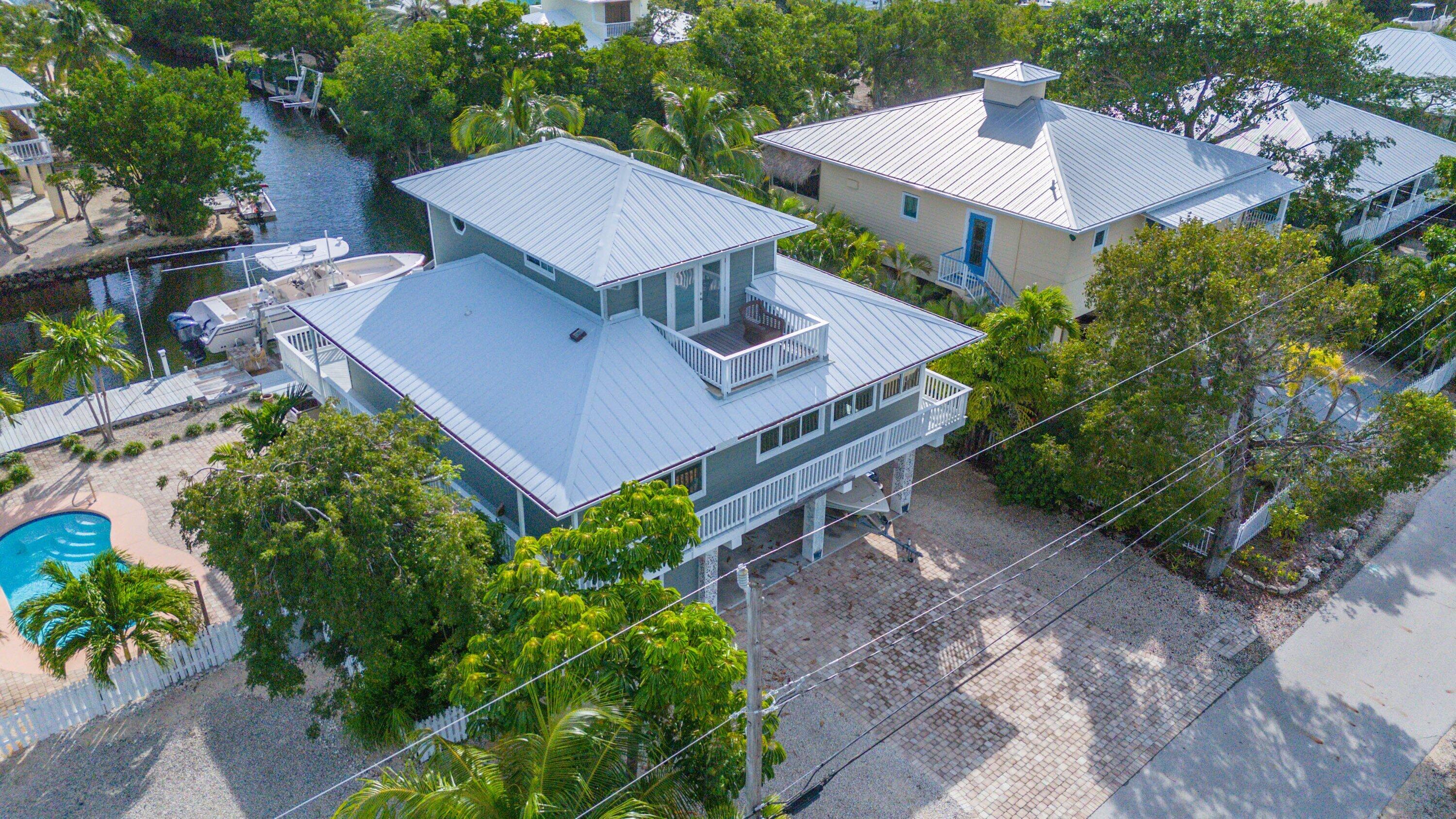 643 Indies Road Summerland Key, FL 33042 - Photo 30 of 50 an aerial view of a house with a yard and a patio