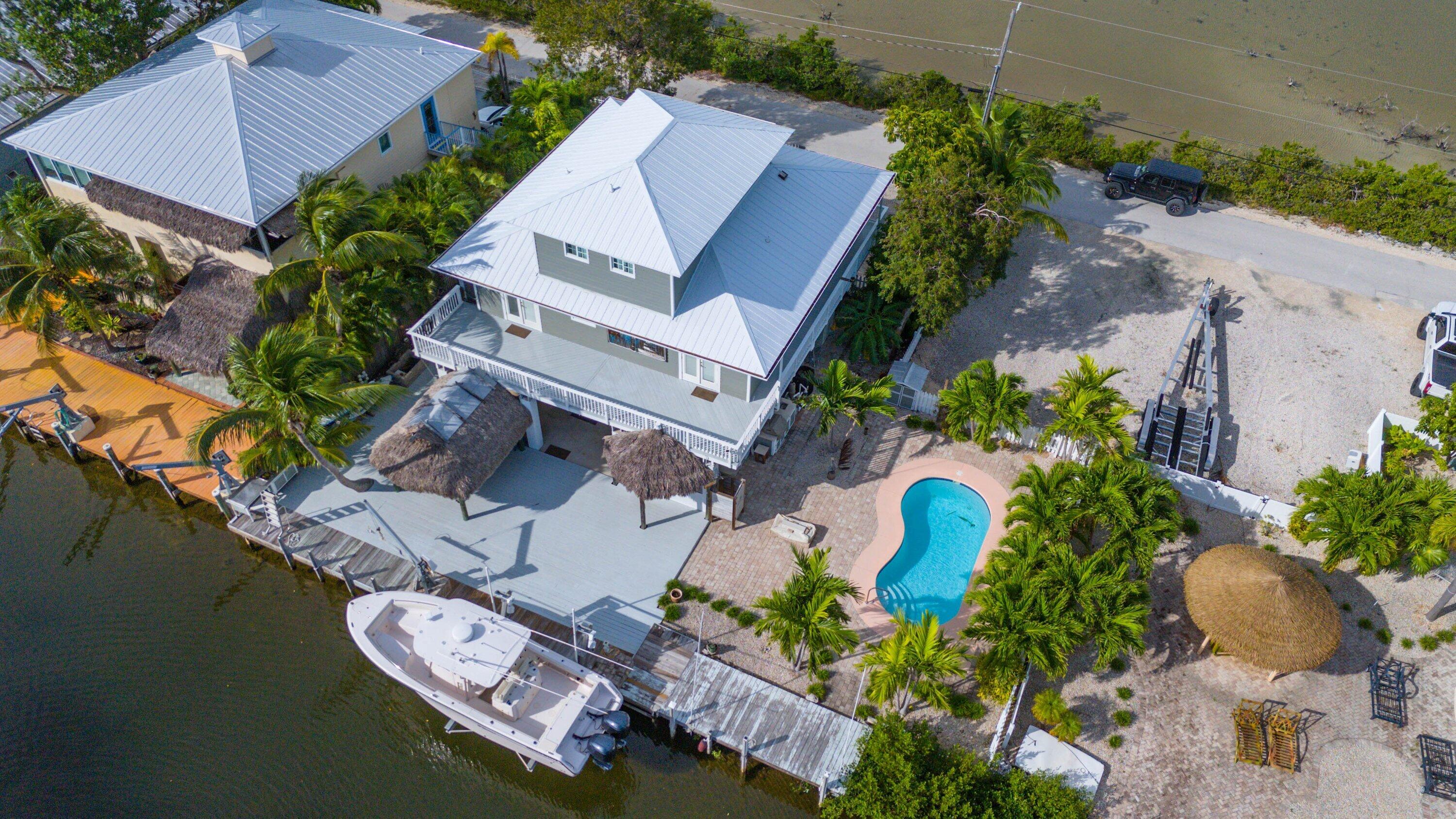 643 Indies Road Summerland Key, FL 33042 - Photo 32 of 50 an aerial view of a house with swimming pool and outdoor space