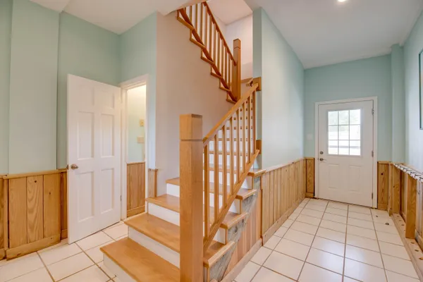 a view of a hallway view with staircase