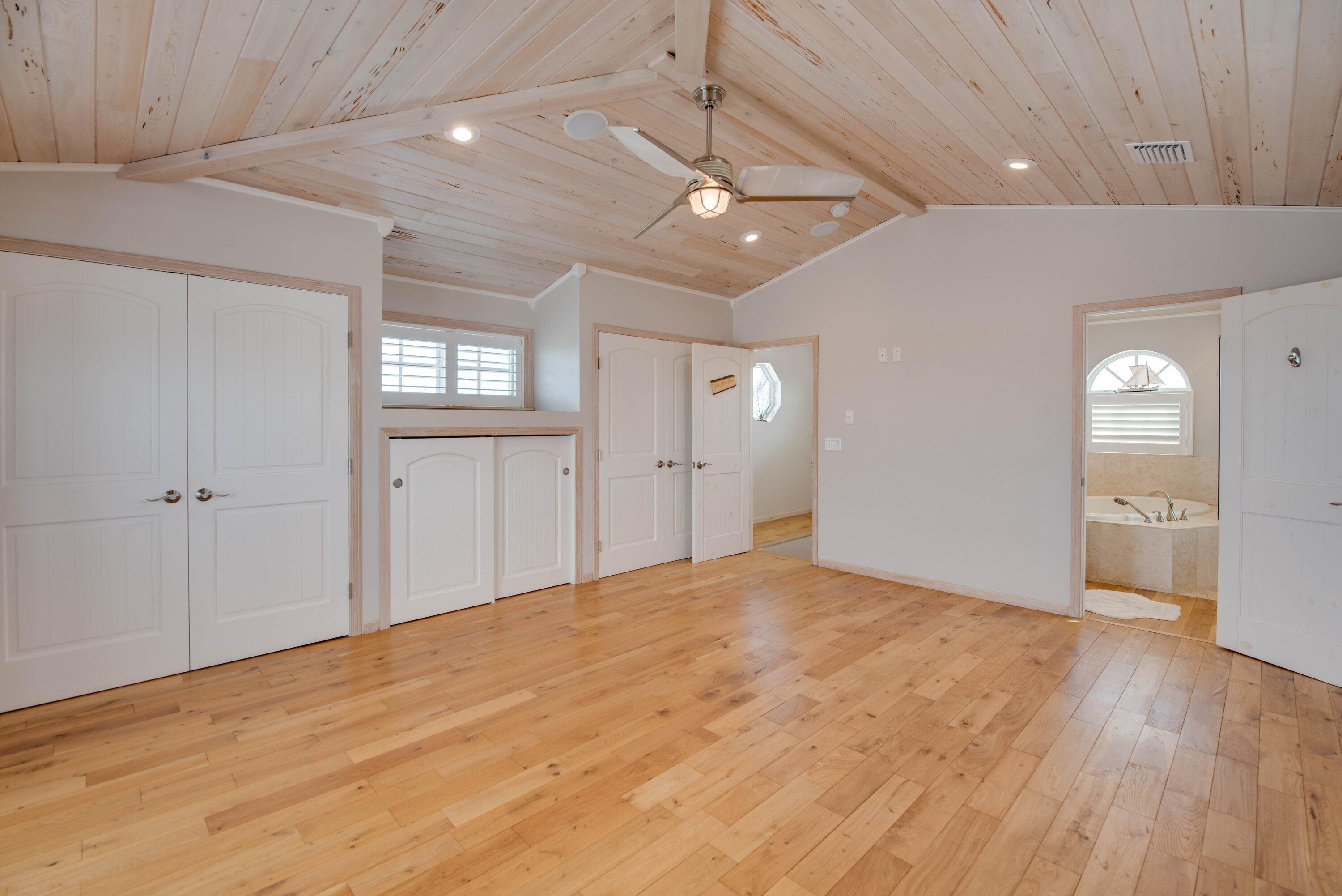 643 Indies Road Summerland Key, FL 33042 - Photo 46 of 50 a view of an empty room with window and wooden floor