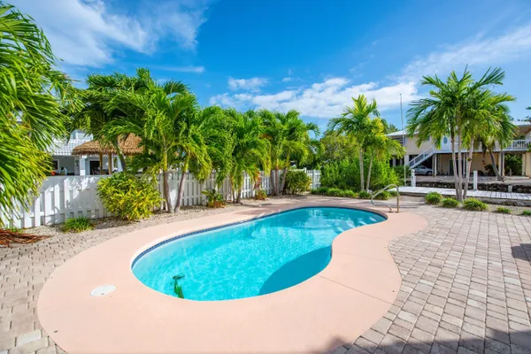 a view of a swimming pool with a patio