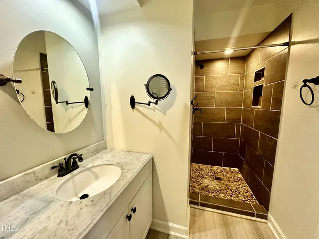 a bathroom with a sink and a mirror
