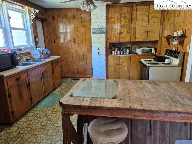 a kitchen with wooden cabinets and a sink