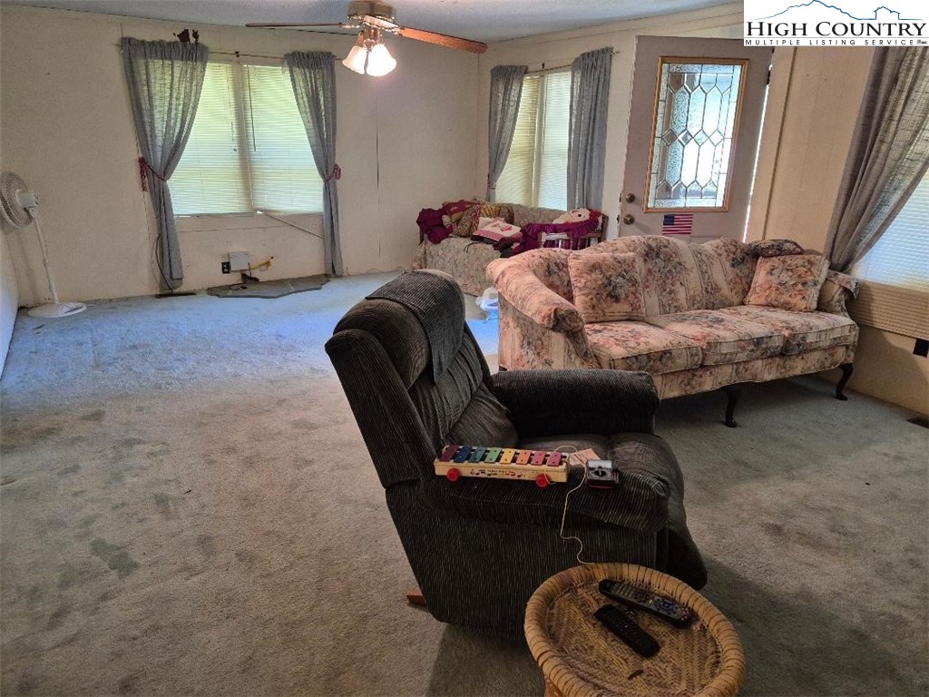 720 Mash Road West Jefferson, NC 28694 - Photo 16 of 31 a living room with furniture and a large window