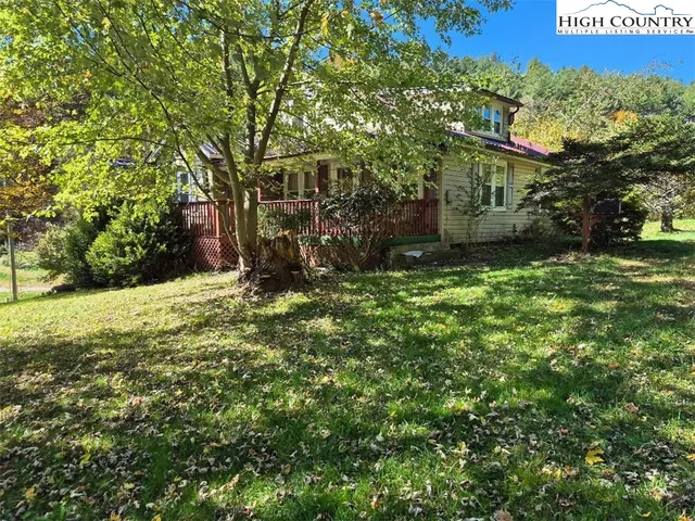 a view of a tree in front of a house