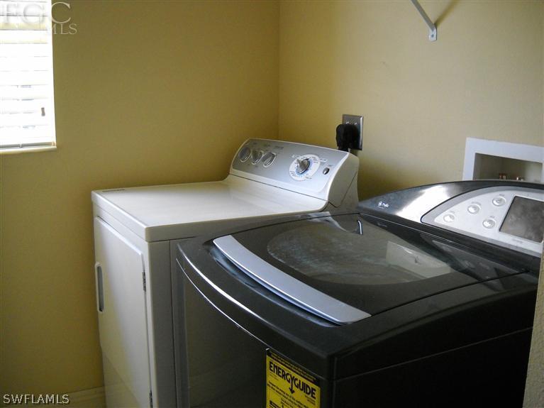 6973 Debrita Road North Port, FL 34291 - Photo 17 of 18 a utility room with dryer and washer