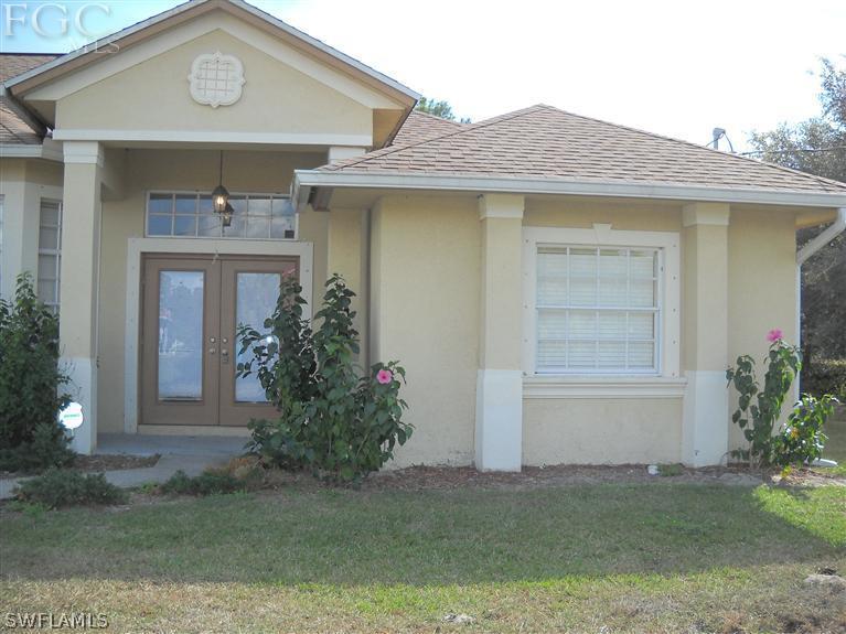 6973 Debrita Road North Port, FL 34291 - Photo 2 of 18 a front view of a house with garden
