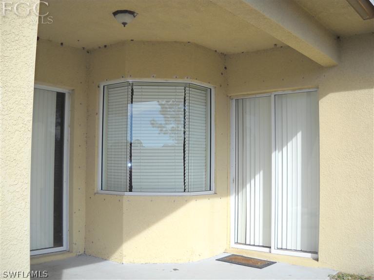 6973 Debrita Road North Port, FL 34291 - Photo 6 of 18 a view of a wooden door