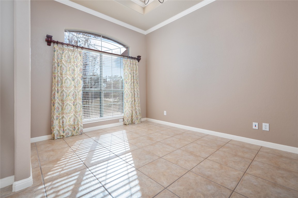 455 Rose Blossom Loop La Vernia, TX 78121 - Photo 18 of 24 a view of an empty room with wooden floor and a window