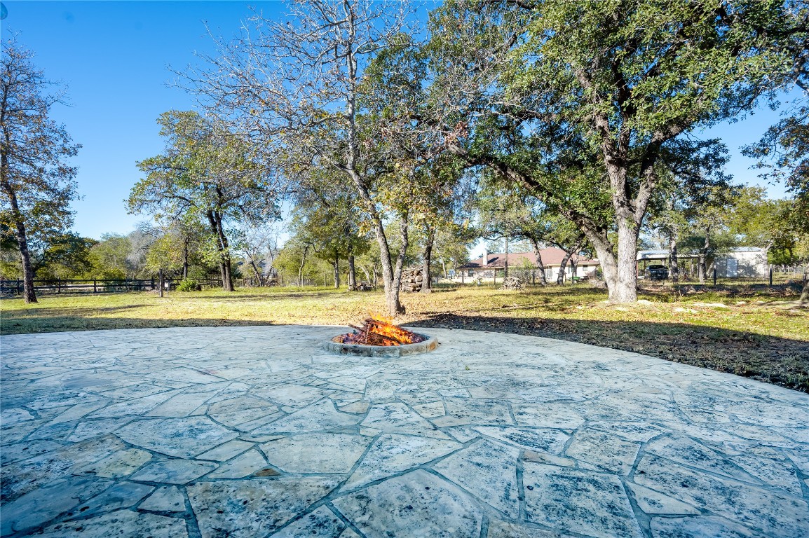455 Rose Blossom Loop La Vernia, TX 78121 - Photo 20 of 24 a view of swimming pool with outdoor seating and yard
