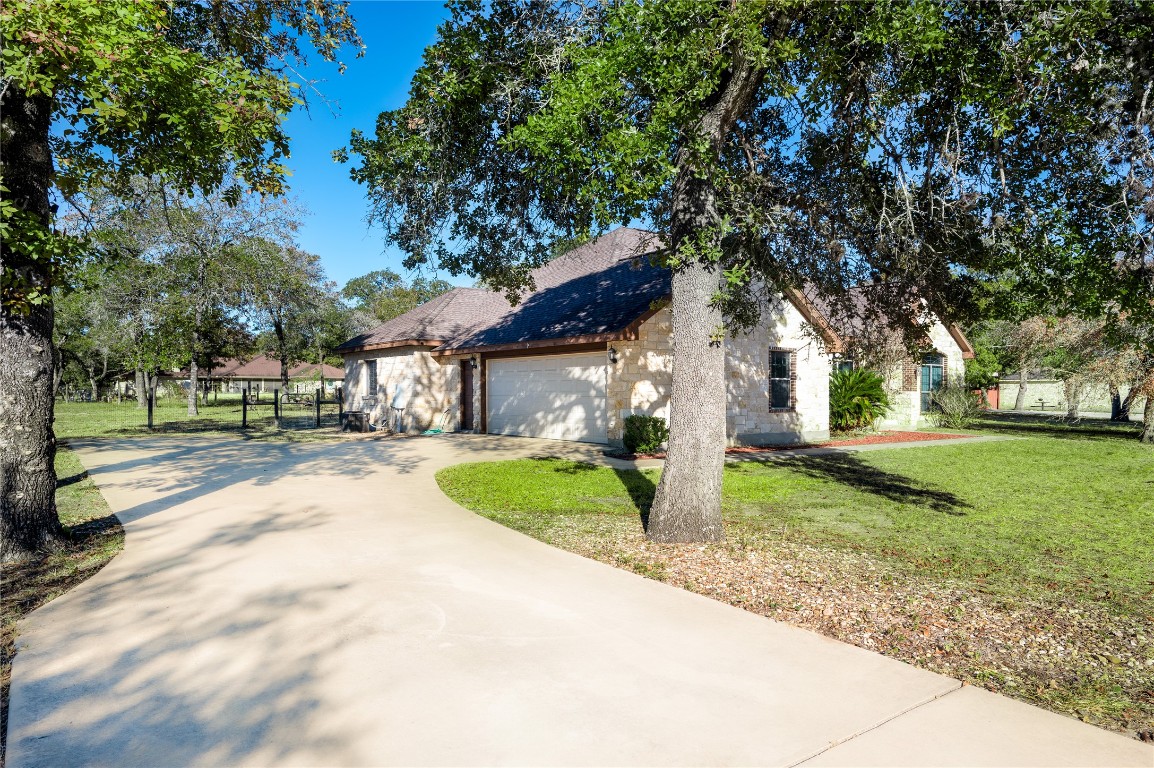 455 Rose Blossom Loop La Vernia, TX 78121 - Photo 24 of 24 a view of a house with a yard and tree s