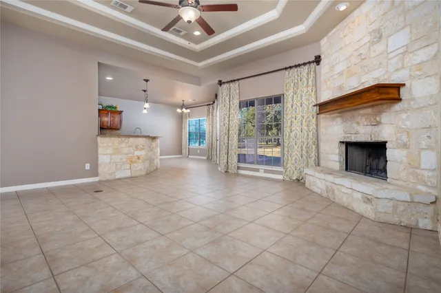 a kitchen with stainless steel appliances granite countertop a sink and wooden cabinets