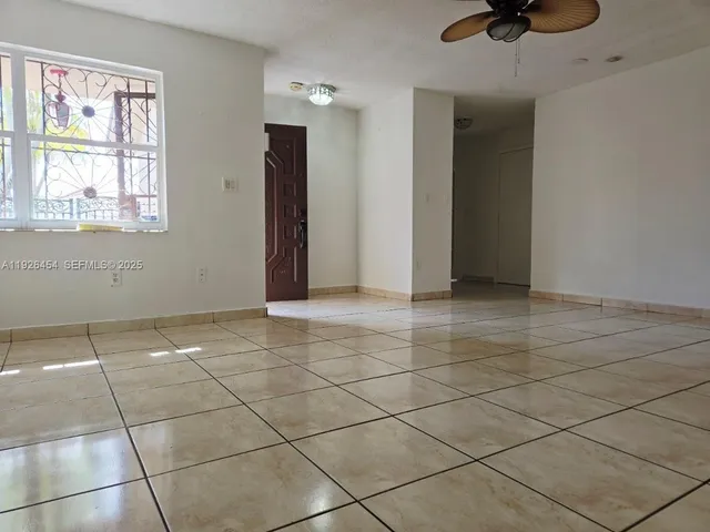 a view of a white house with a outdoor space