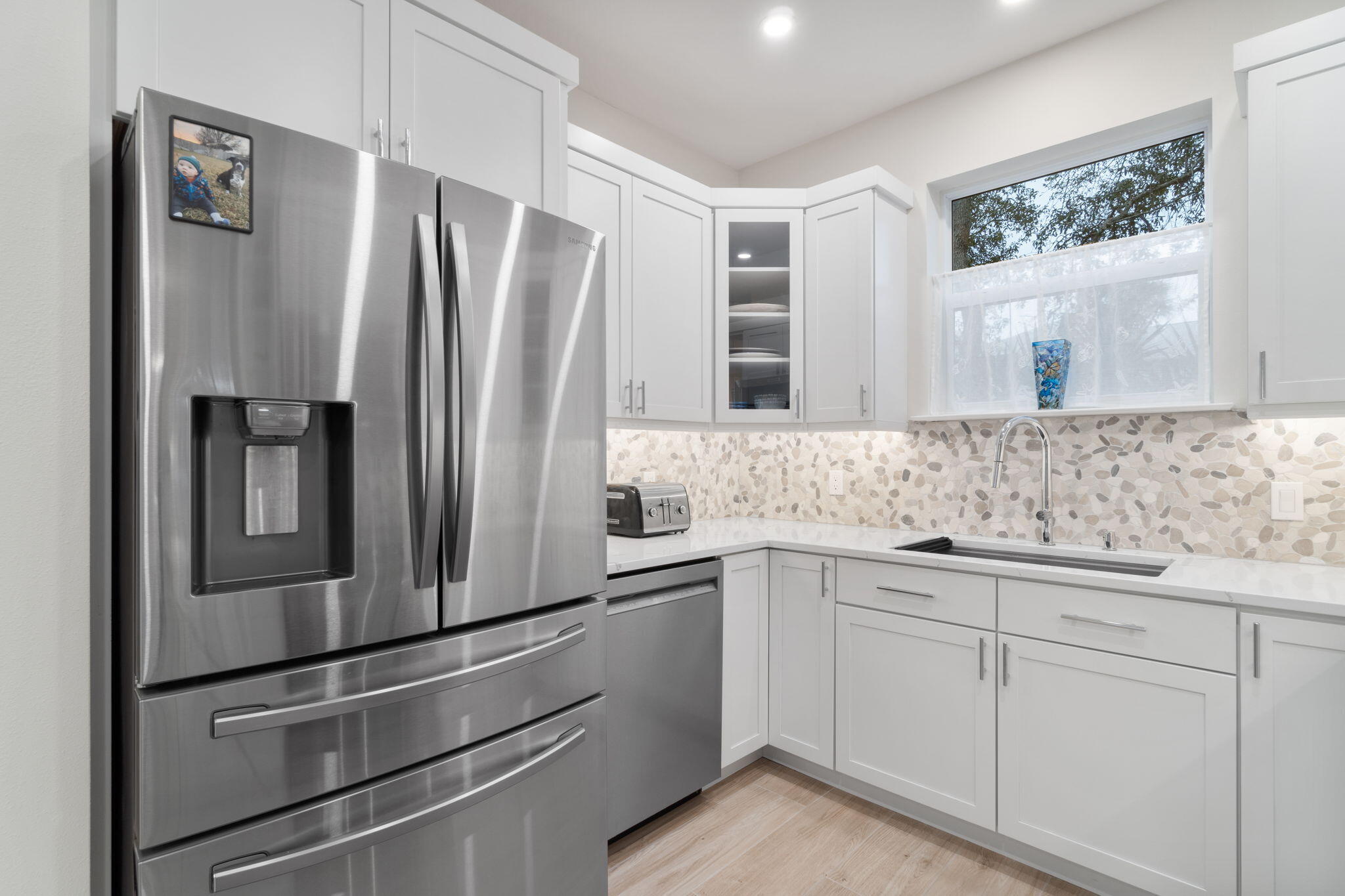 362 South Holiday Road Miramar Beach, FL 32550 - Photo 16 of 51 a kitchen with stainless steel appliances white cabinets and a refrigerator