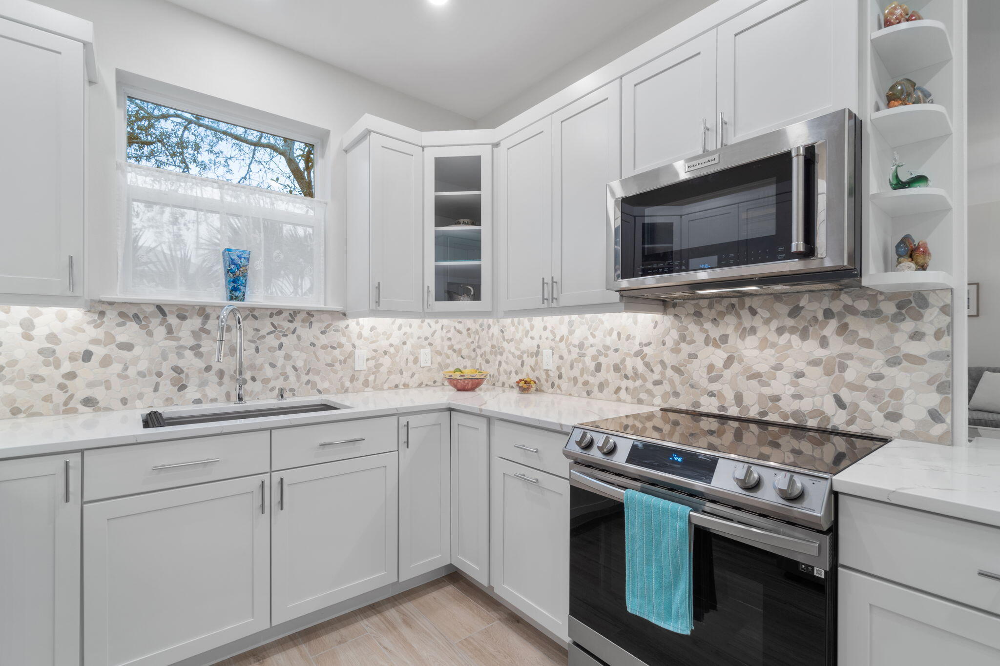 362 South Holiday Road Miramar Beach, FL 32550 - Photo 17 of 51 a kitchen with stainless steel appliances granite countertop white cabinets a microwave oven and a sink