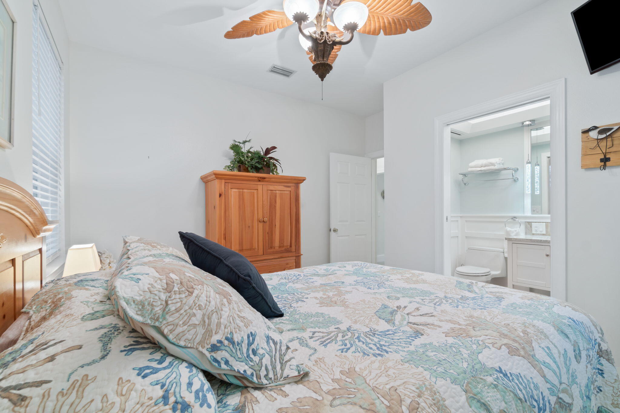 362 South Holiday Road Miramar Beach, FL 32550 - Photo 21 of 51 a bedroom with a bed and a chandelier
