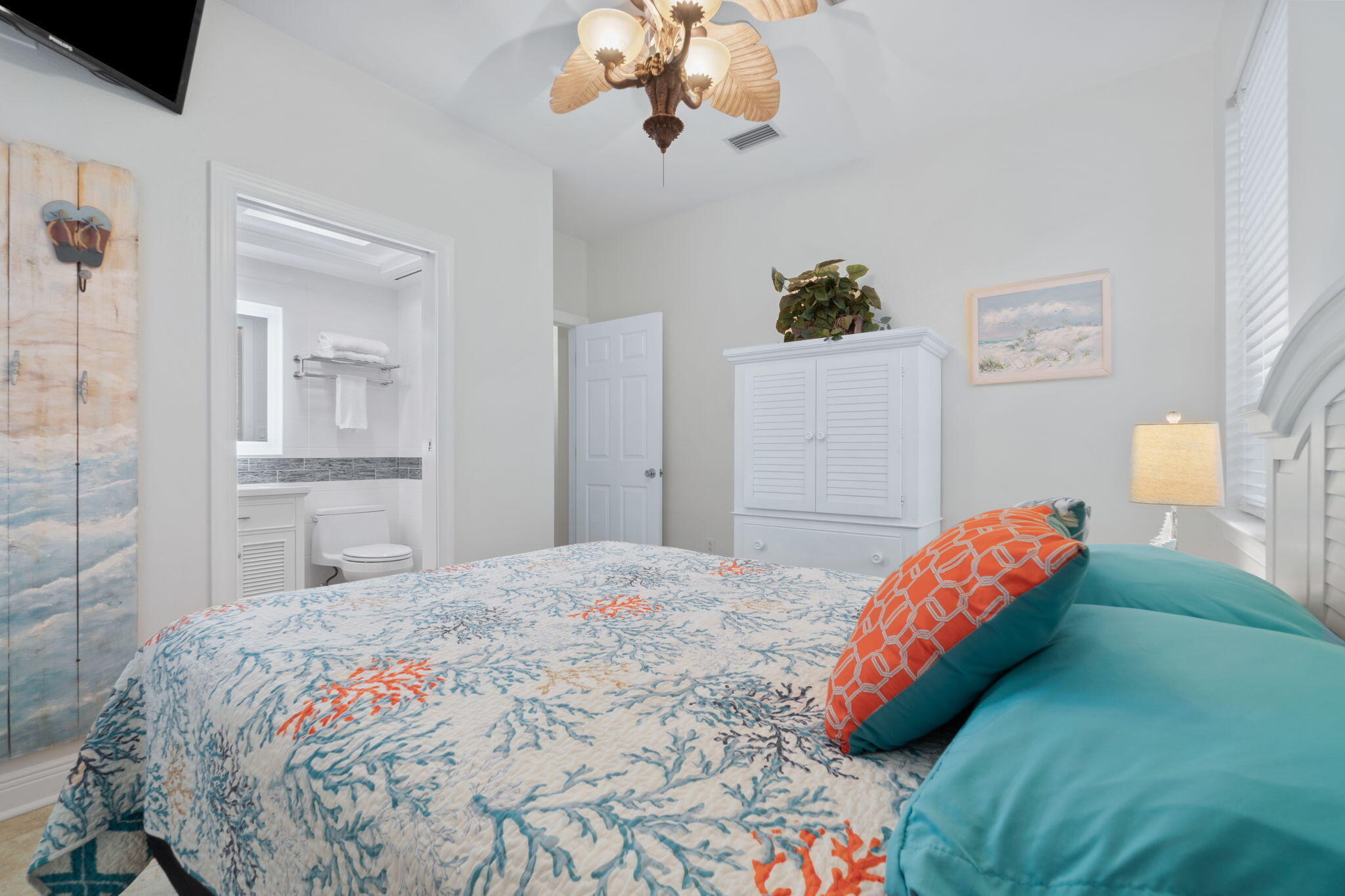 362 South Holiday Road Miramar Beach, FL 32550 - Photo 24 of 51 a bedroom with a bed and a chandelier