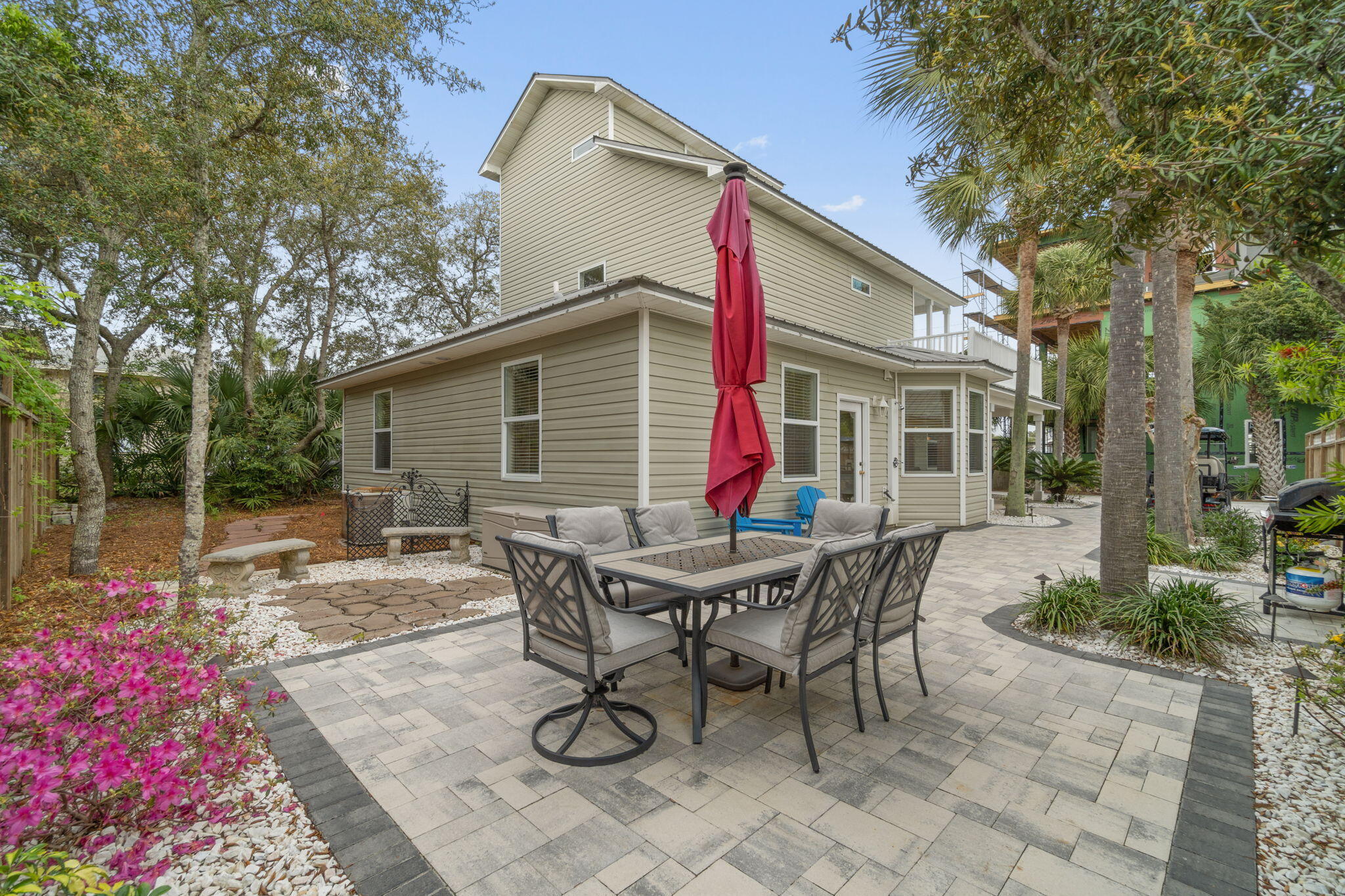 362 South Holiday Road Miramar Beach, FL 32550 - Photo 4 of 51 a view of a dinning table and chairs in backyard of the house