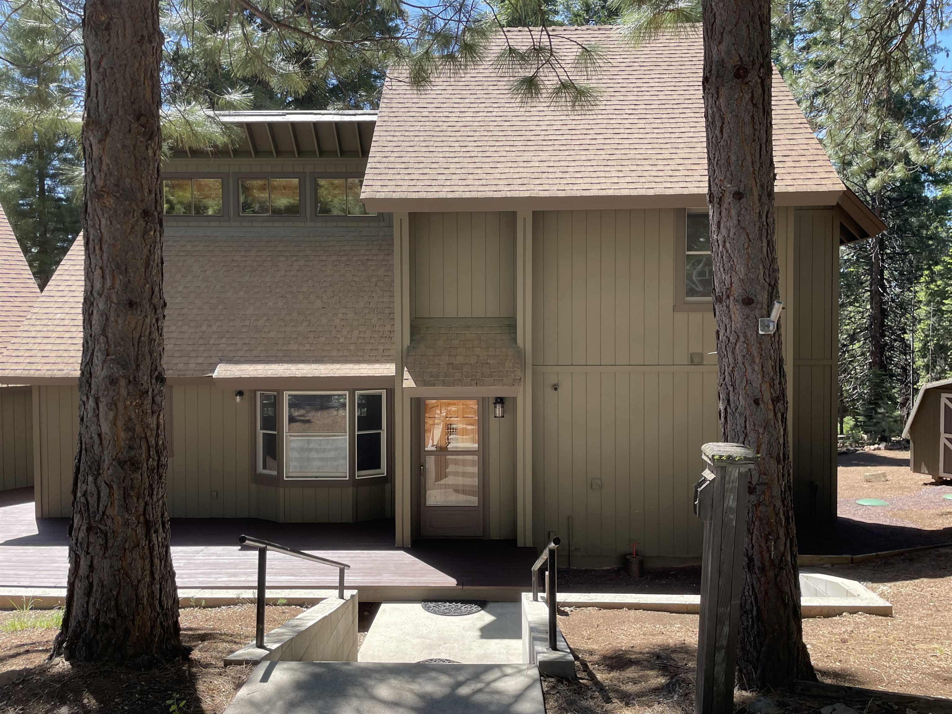 603 East Burnt Cedar Road Lake Almanor, CA 96137 - Photo 2 of 33 a front view of a house with a yard