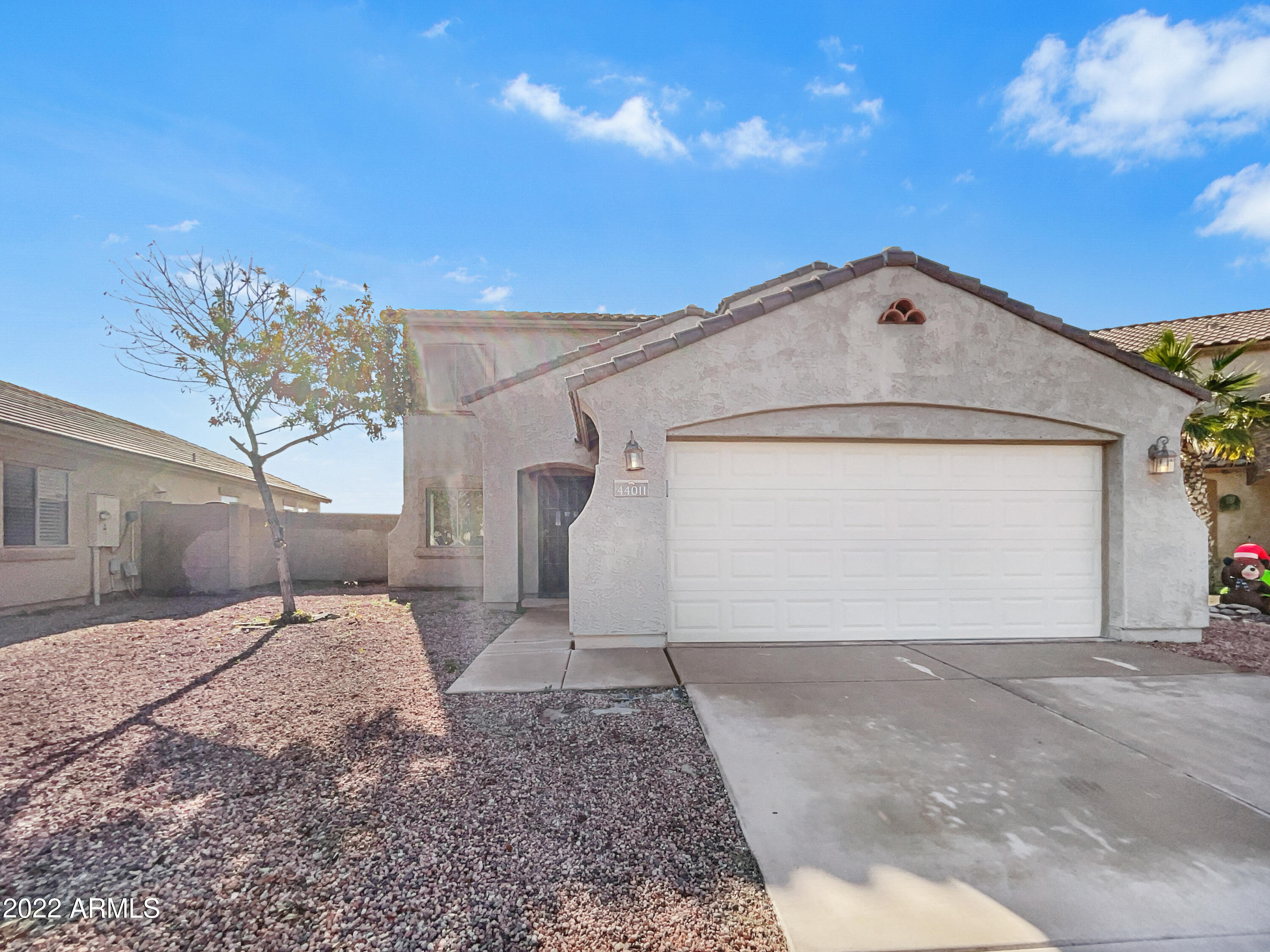 44011 West Cowpath Road Maricopa, AZ 85138 - Photo 1 of 18 a view of a house with a yard