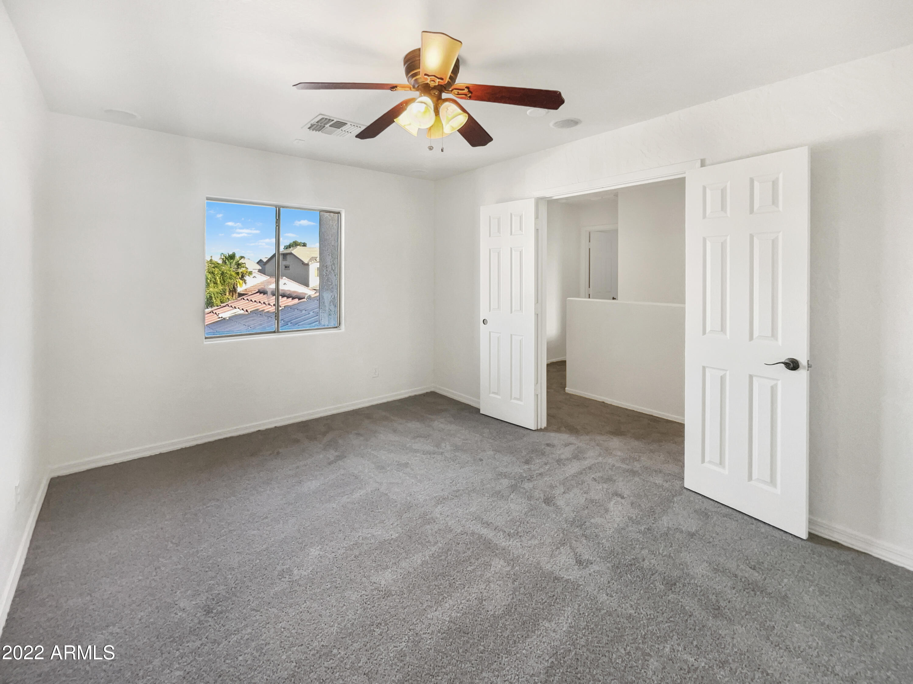 44011 West Cowpath Road Maricopa, AZ 85138 - Photo 14 of 18 a view of an empty room with a window