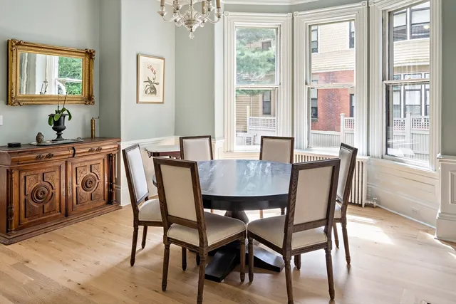 a view of a dining room with furniture window and outside view