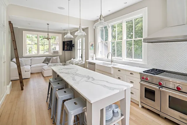 a kitchen with a stove a sink and a refrigerator
