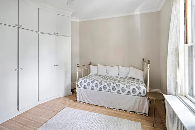 a room with a bed and a window