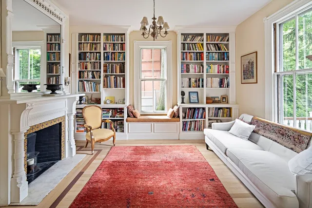 a living room with furniture and a fireplace