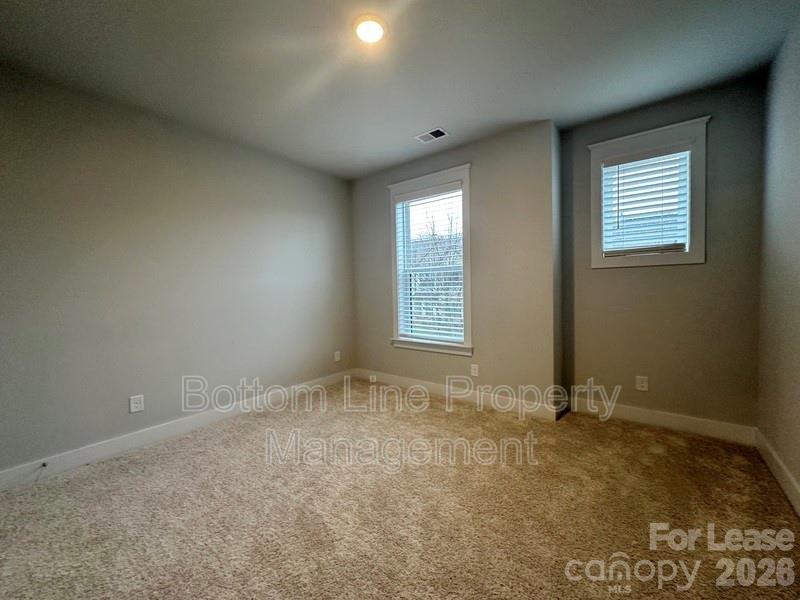5915 Ardrey Kell Road Charlotte, NC 28105 - Photo 13 of 19 an empty room with windows