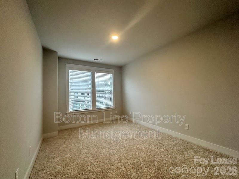 5915 Ardrey Kell Road Charlotte, NC 28105 - Photo 14 of 19 an empty room with a window