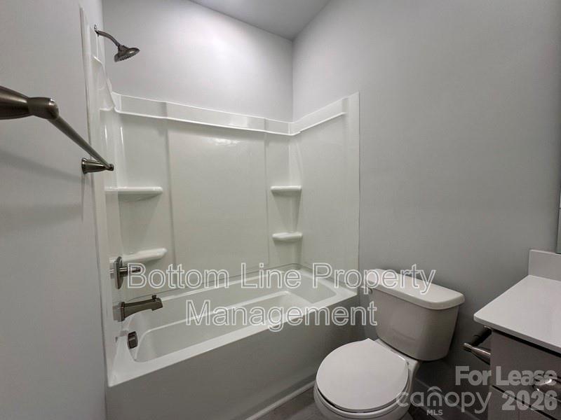 5915 Ardrey Kell Road Charlotte, NC 28105 - Photo 15 of 19 a bathroom with a sink toilet and shower