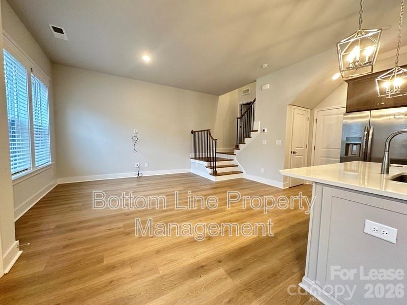5915 Ardrey Kell Road Charlotte, NC 28105 - Photo 6 of 19 a view of a kitchen with a sink