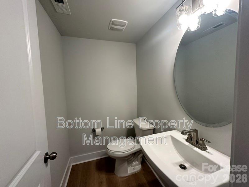 5915 Ardrey Kell Road Charlotte, NC 28105 - Photo 7 of 19 a bathroom with a sink and a mirror