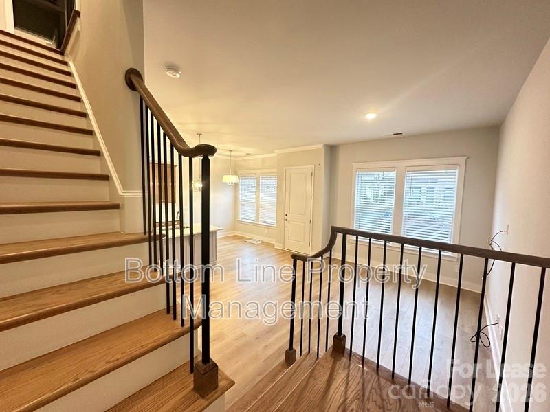 5915 Ardrey Kell Road Charlotte, NC 28105 - Photo 8 of 19 a view of entryway with wooden floor and stairs