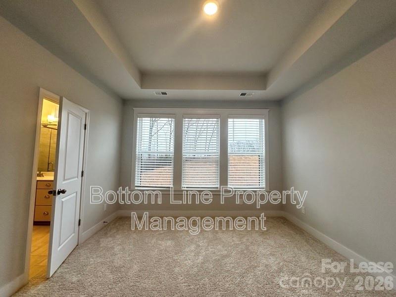 5915 Ardrey Kell Road Charlotte, NC 28105 - Photo 9 of 19 a view of an empty room and window