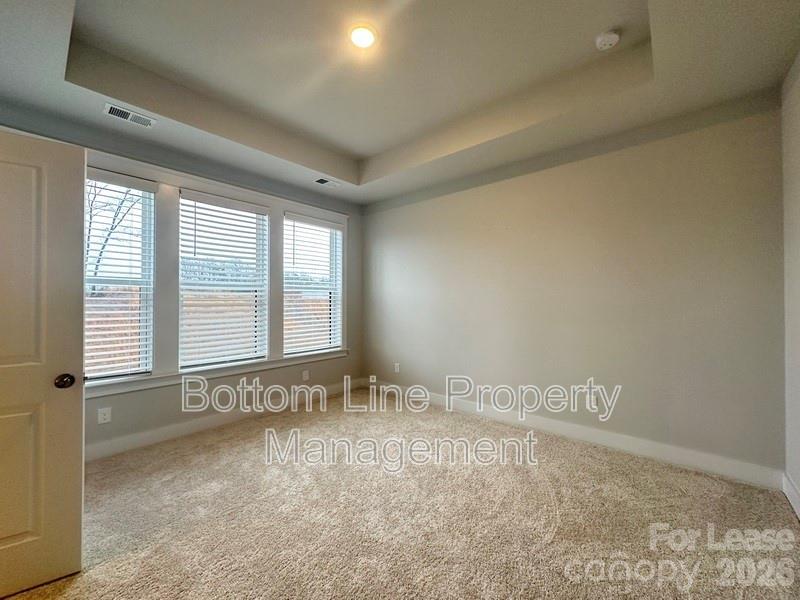 5915 Ardrey Kell Road Charlotte, NC 28105 - Photo 10 of 19 a view of an empty room and a window