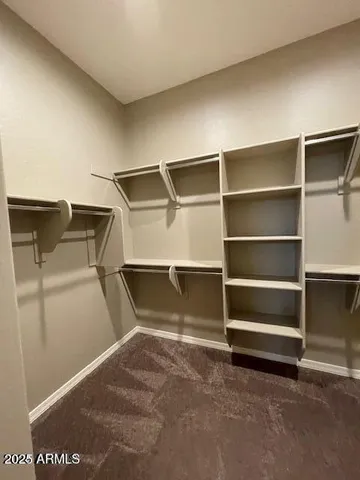 a view of an empty room with empty shelves