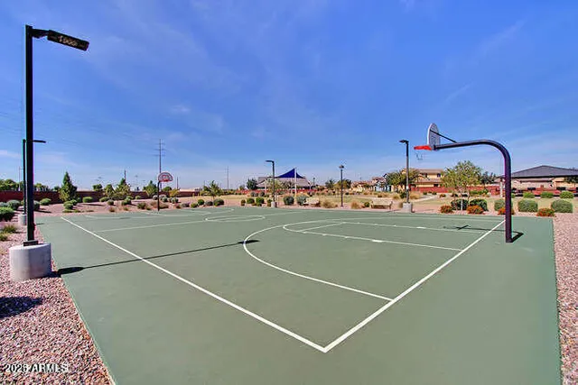 a view of a swimming pool and outdoor seating