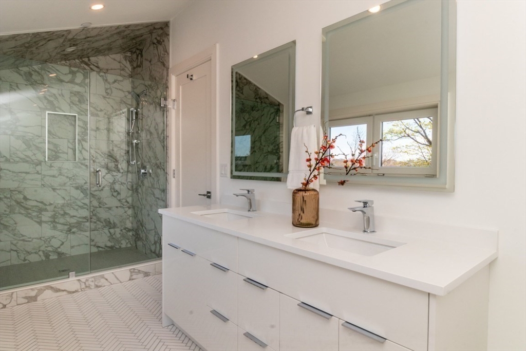 15 Tanglewood Road, Unit A Boston, MA 02126 - Photo 14 of 28 a bathroom with a sink and a mirror