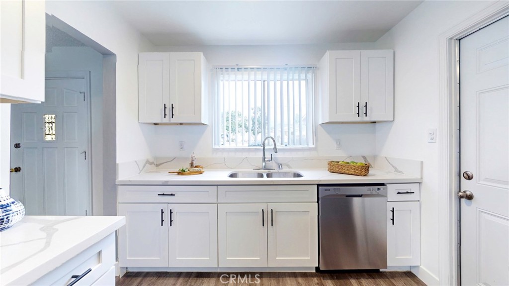 10915 Eldora Avenue Sunland, CA 91040 - Photo 12 of 39 a kitchen with white cabinets and sink