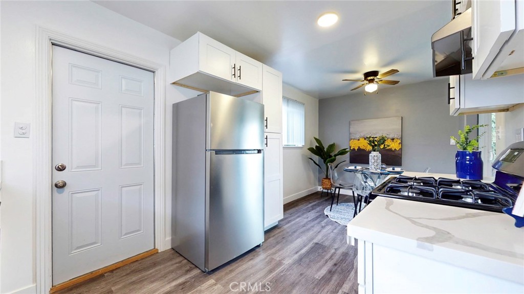 10915 Eldora Avenue Sunland, CA 91040 - Photo 14 of 39 a very nice looking room with a wooden floor and a cabinet