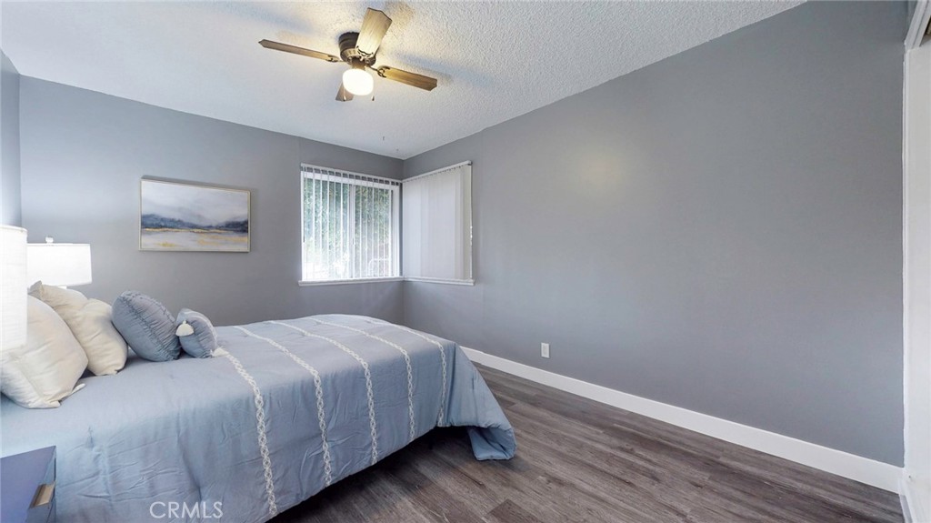 10915 Eldora Avenue Sunland, CA 91040 - Photo 15 of 39 a bedroom with a bed and a chandelier